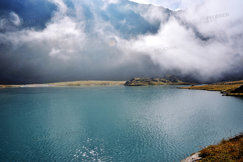 Last Wafts of Mist at the mountain lake Lac Goléon, French Alps, France